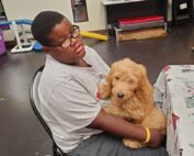 Man with Puppy in Lap