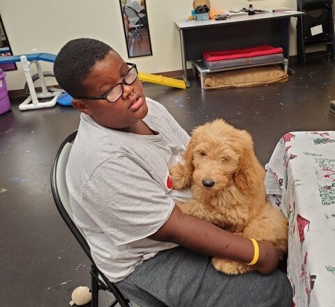 Man with Puppy in Lap